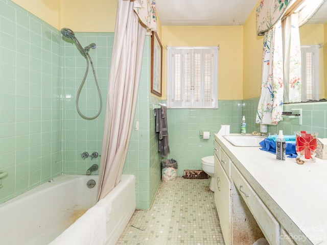 full bathroom with decorative backsplash, toilet, vanity, tile walls, and shower / bath combination with curtain