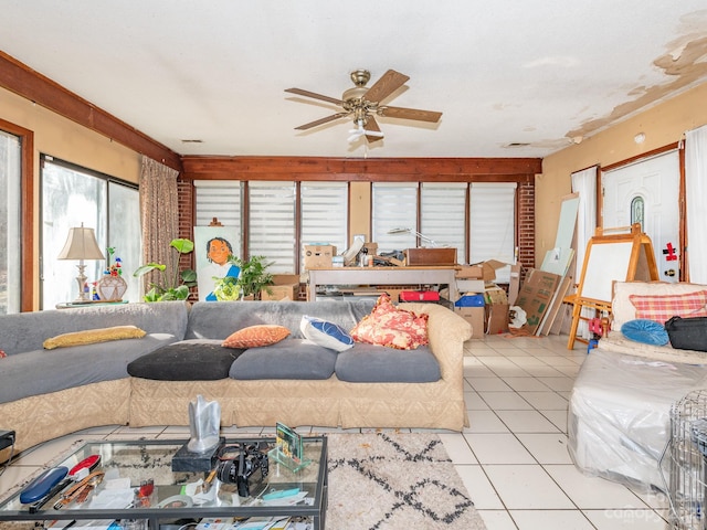 tiled living room with ceiling fan