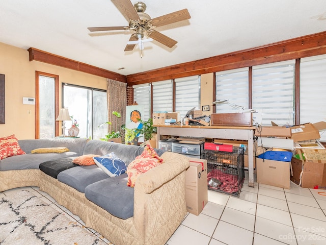 living room with ceiling fan and light tile patterned floors