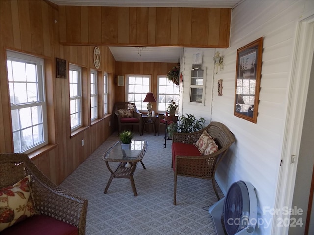 sunroom / solarium featuring plenty of natural light and vaulted ceiling