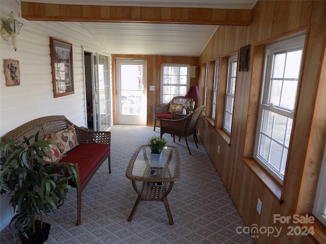 sunroom / solarium with a wealth of natural light and lofted ceiling with beams