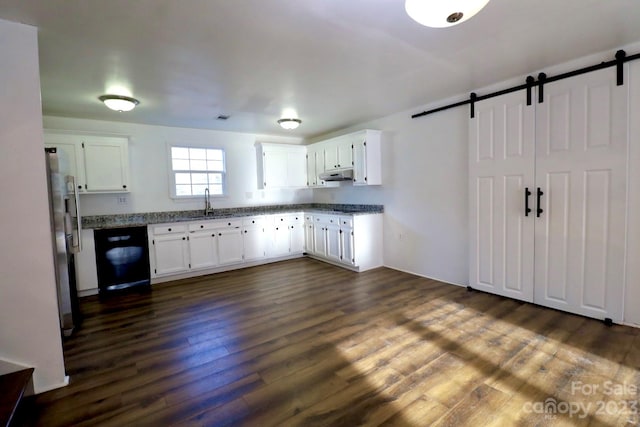 kitchen featuring white cabinetry, black dishwasher, dark wood-type flooring, and a barn door