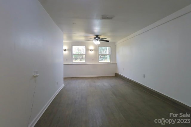 unfurnished room featuring ceiling fan and dark hardwood / wood-style floors