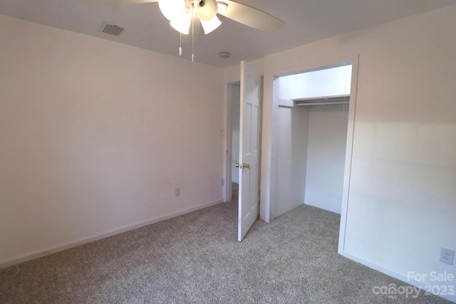 unfurnished bedroom with light carpet, a closet, and ceiling fan