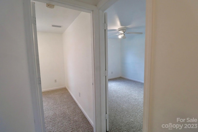 hallway with light carpet