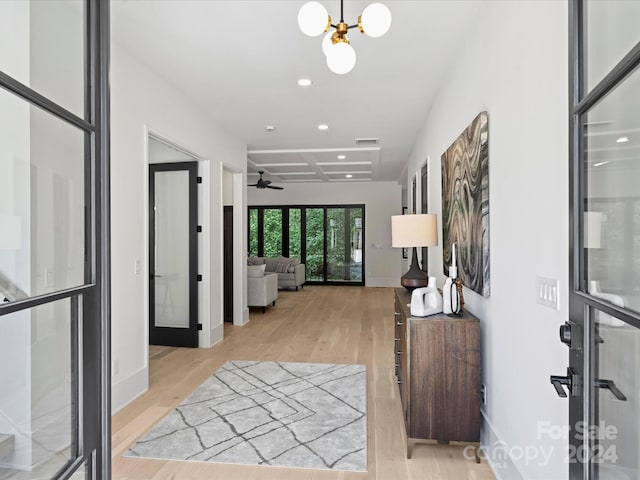 corridor with light hardwood / wood-style flooring