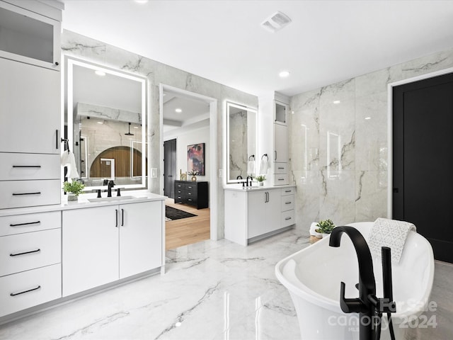 bathroom with vanity, tile walls, hardwood / wood-style flooring, and independent shower and bath