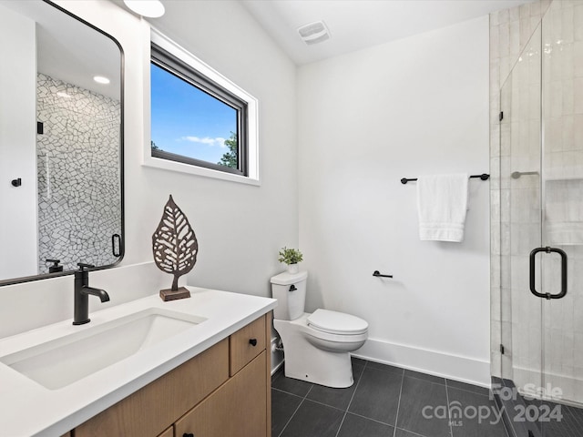 bathroom featuring tile patterned flooring, toilet, vanity, and an enclosed shower