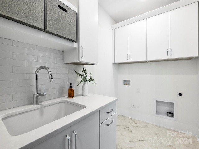 laundry area with gas dryer hookup, washer hookup, cabinets, electric dryer hookup, and sink