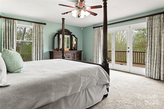 bedroom featuring a textured ceiling, access to outside, ceiling fan, french doors, and carpet floors