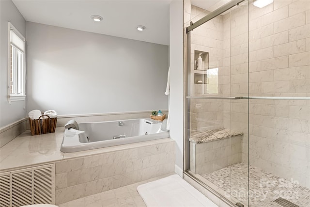 bathroom featuring tile patterned floors and shower with separate bathtub