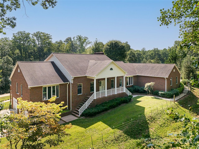 ranch-style home with a front yard