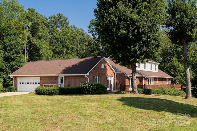 view of front of home featuring a garage and a front lawn