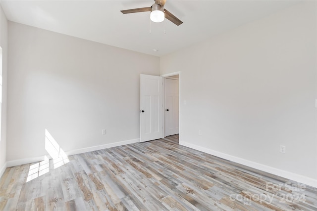 unfurnished room with ceiling fan and light hardwood / wood-style floors