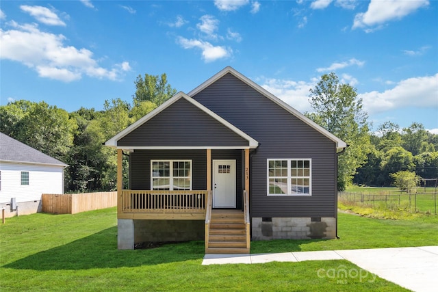 bungalow-style home featuring covered porch and a front yard