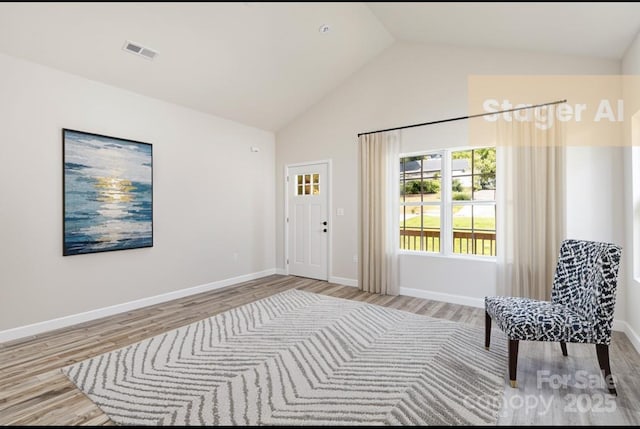 213 Sheffield Dr, York, SC 29745 - sitting room with wood finished floors, high vaulted ceiling, and baseboards