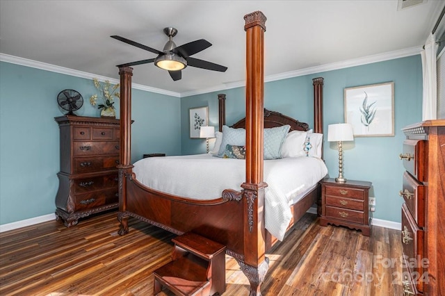 bedroom with decorative columns, dark hardwood / wood-style flooring, ceiling fan, and ornamental molding