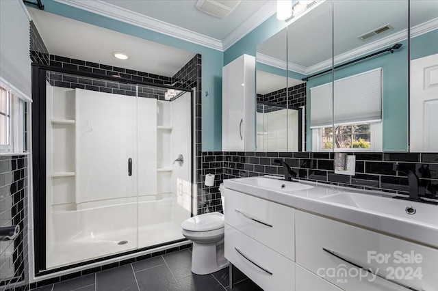 bathroom featuring an enclosed shower, tile patterned floors, vanity, tile walls, and toilet