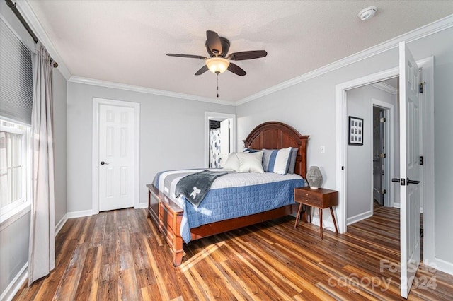 bedroom featuring ceiling fan, ornamental molding, dark wood-type flooring, and a textured ceiling