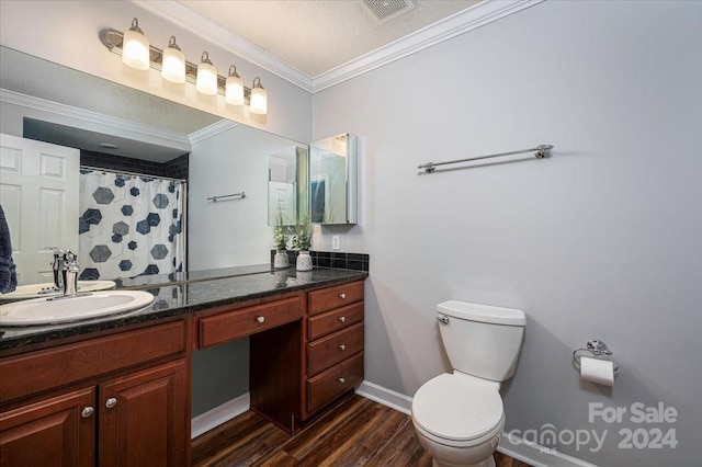 bathroom with wood-type flooring, a textured ceiling, toilet, vanity, and ornamental molding