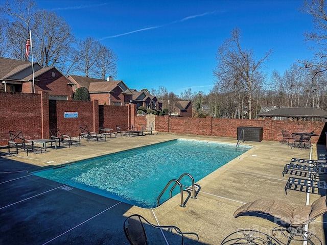 view of swimming pool featuring a patio area