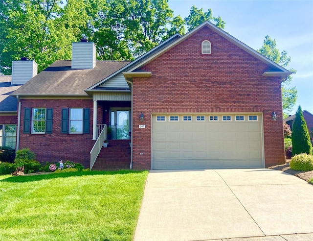 view of front of house with a garage and a front lawn