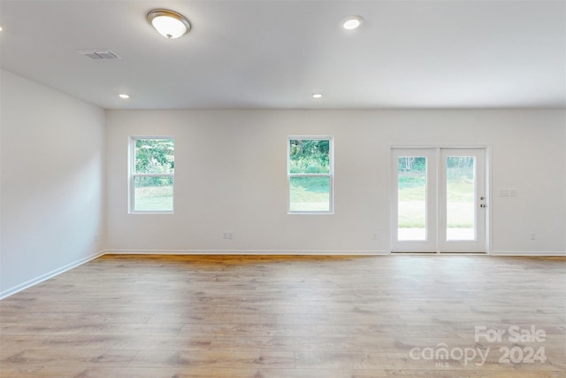 unfurnished room featuring light wood-type flooring