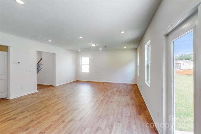 unfurnished room with light hardwood / wood-style flooring