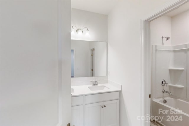 bathroom featuring shower / bathing tub combination and vanity