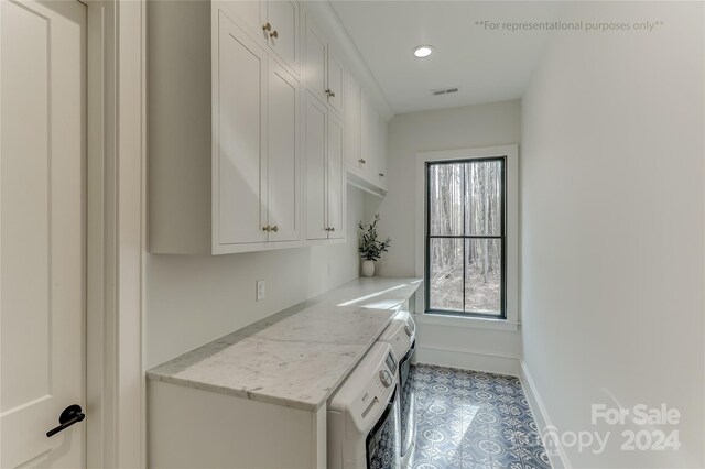 washroom featuring washer / dryer and light tile flooring