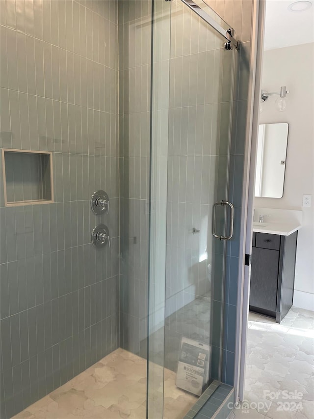 bathroom featuring vanity and walk in shower