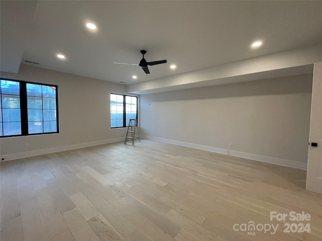 unfurnished room featuring ceiling fan and light hardwood / wood-style floors