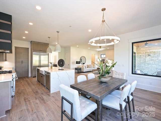 dining space featuring wood-type flooring