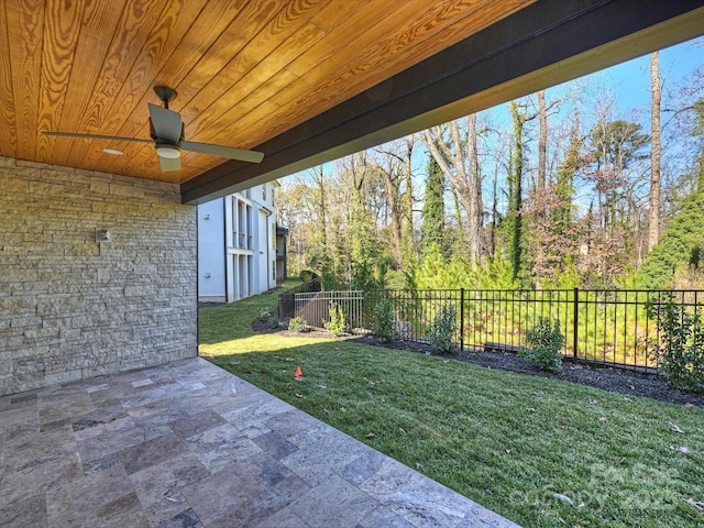 view of yard featuring a patio and ceiling fan