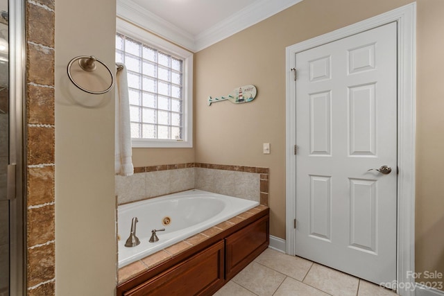 bathroom featuring tile flooring, crown molding, and a bathtub