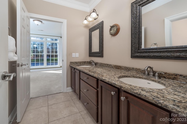 bathroom featuring dual vanity, tile flooring, and ornamental molding