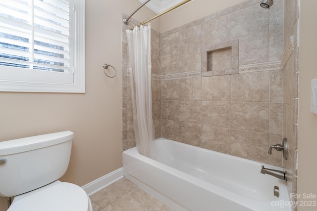 bathroom with tile floors, toilet, and shower / bath combo