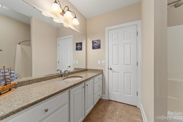 bathroom with tile flooring and vanity