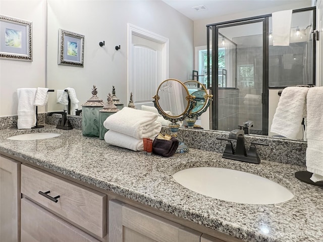 bathroom with oversized vanity and dual sinks