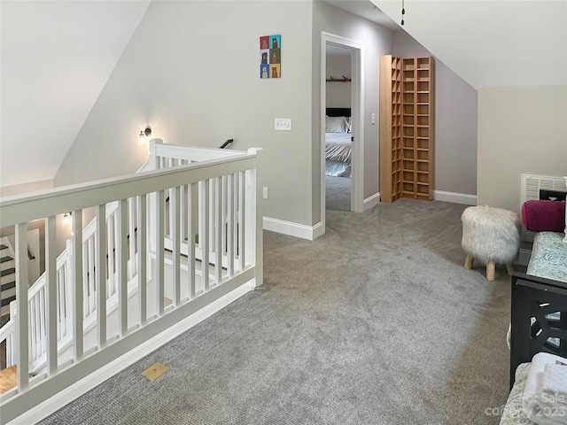 interior space with lofted ceiling and light colored carpet