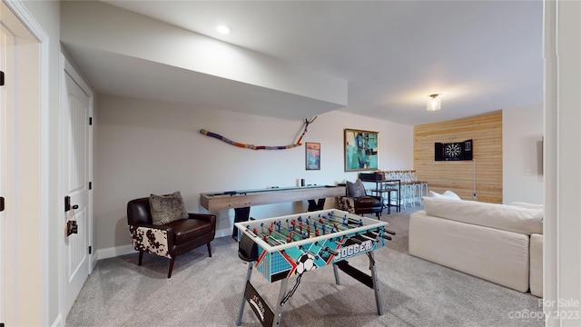 game room featuring light carpet