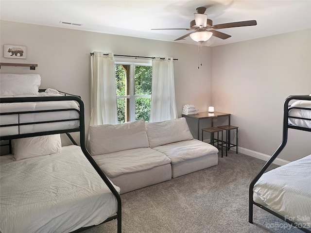 bedroom featuring light colored carpet and ceiling fan