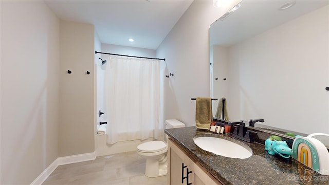 full bathroom with toilet, tile floors, vanity with extensive cabinet space, and shower / bath combo with shower curtain