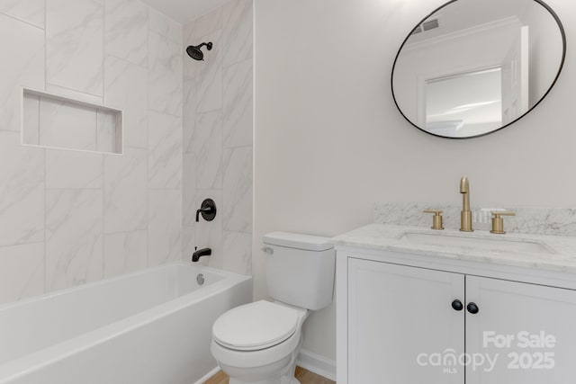 full bathroom with tiled shower / bath, vanity, and toilet