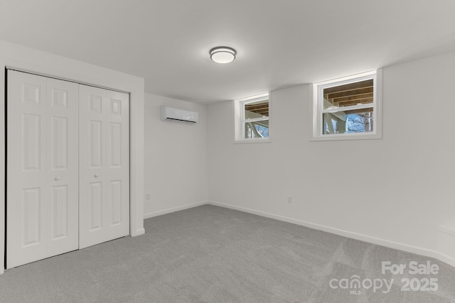 basement with a wall mounted air conditioner and light carpet