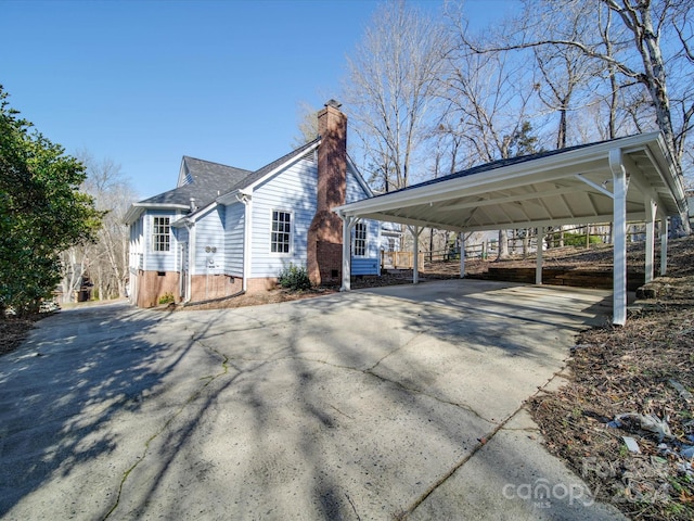 view of property exterior with a carport