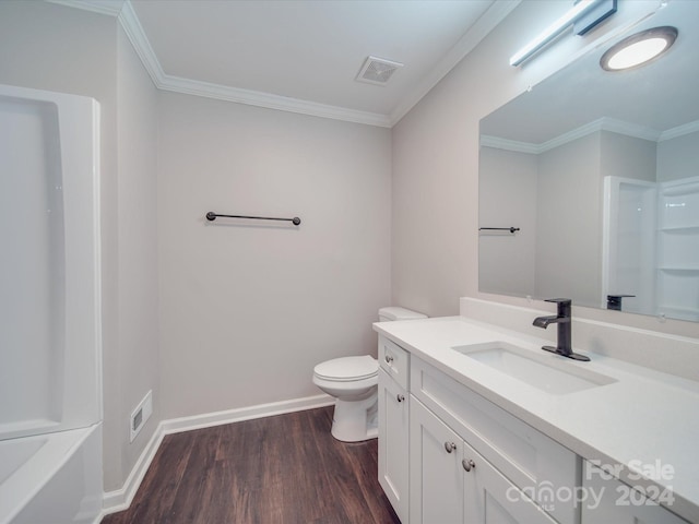 full bathroom with toilet, ornamental molding, wood-type flooring, and vanity