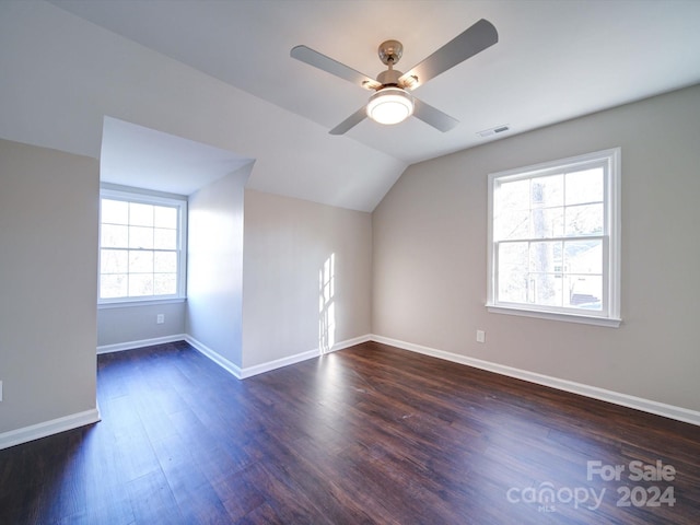 bonus room with ceiling fan, lofted ceiling, and dark wood-type flooring