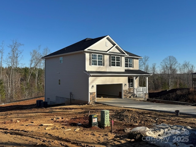 exterior space featuring a garage and central AC unit