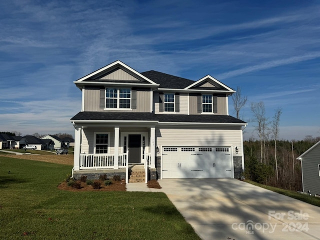 craftsman inspired home featuring a front yard, a porch, and a garage